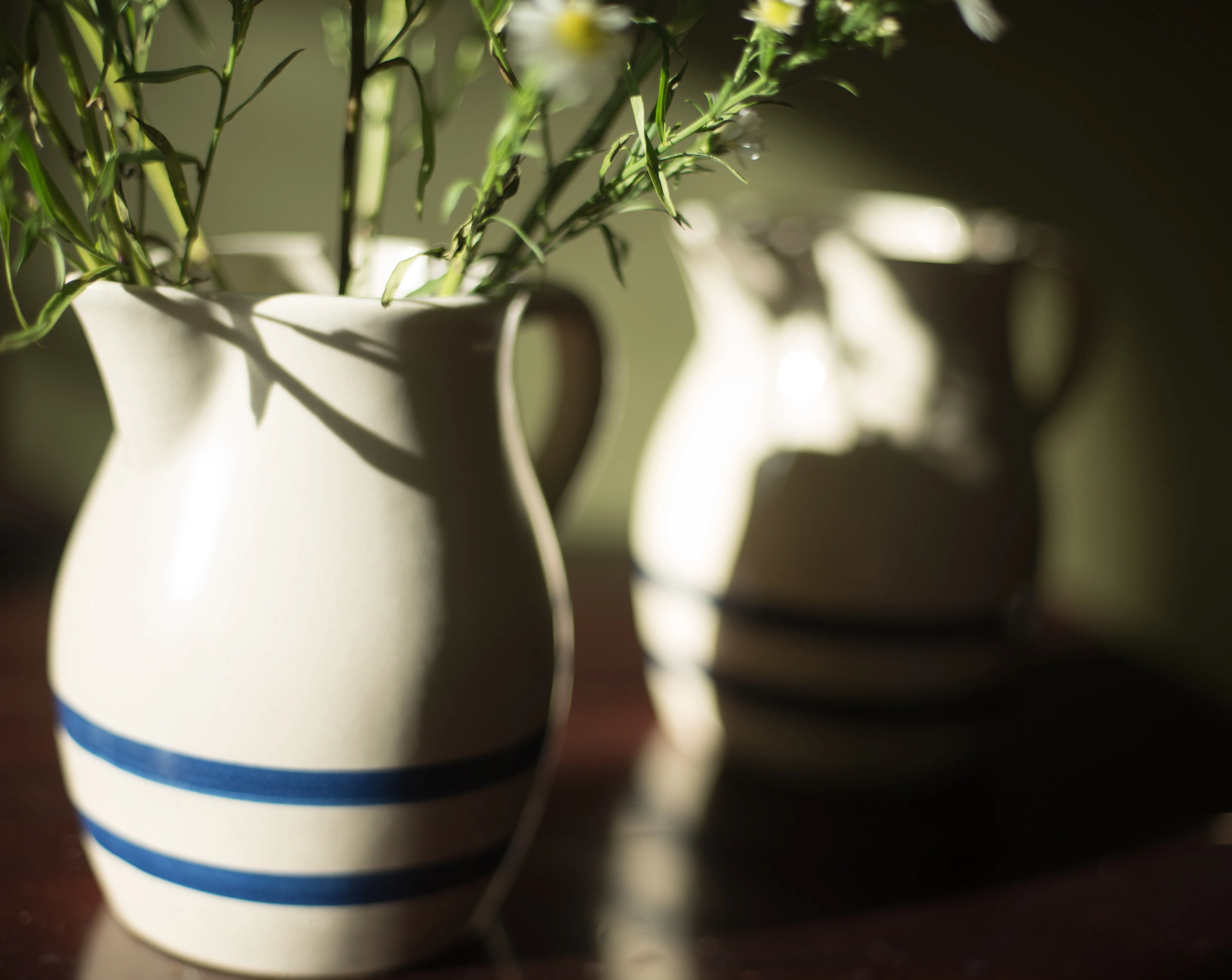Antique Roseville stoneware one quart pitchers