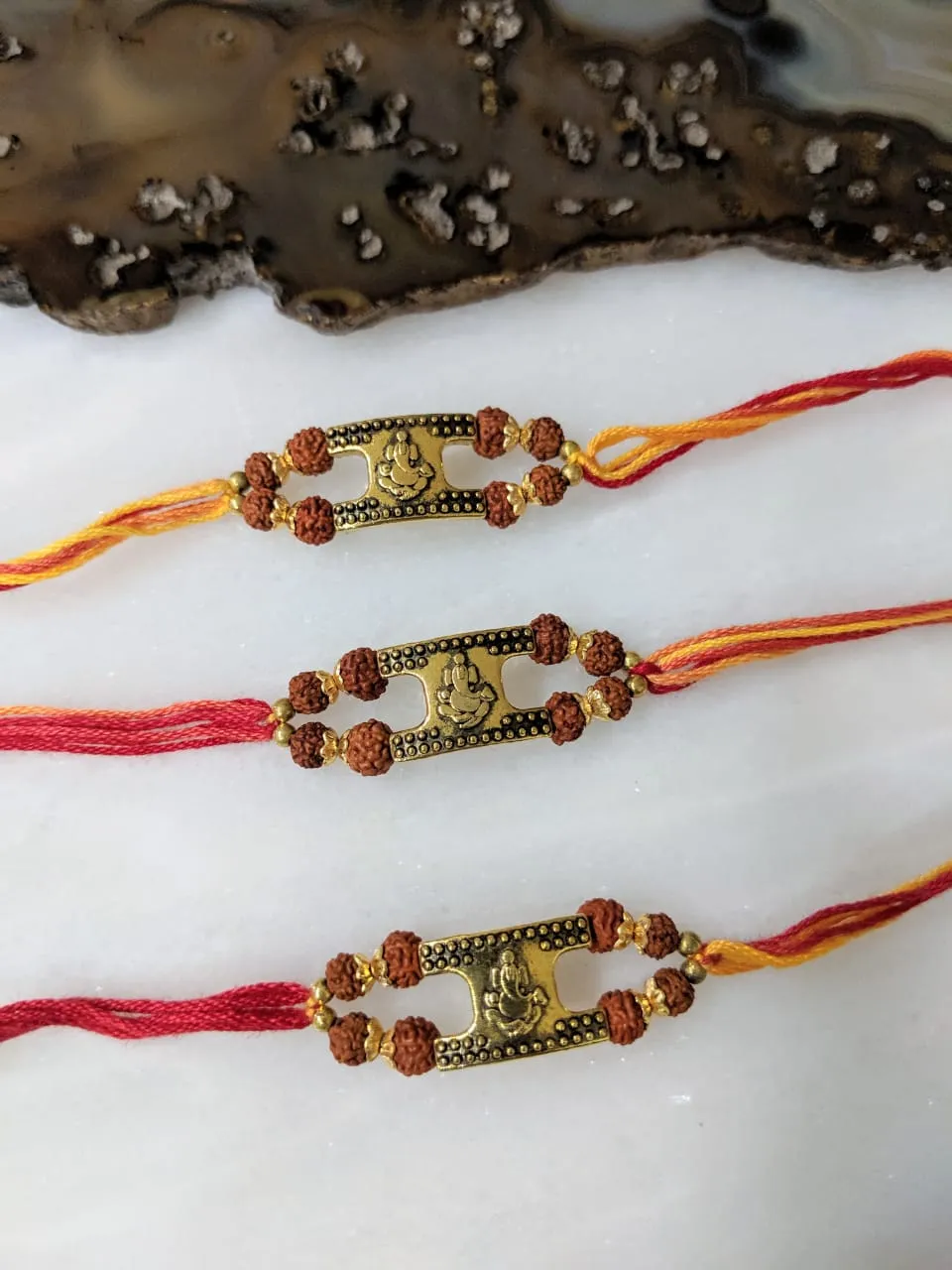 (Set of 3) Golden Rakhi with Ganesh Ji Rudraksha Beads Multicolor Thread Rakhi For Men